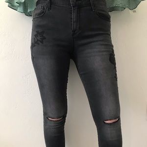 Black jeans with black floral embroidery